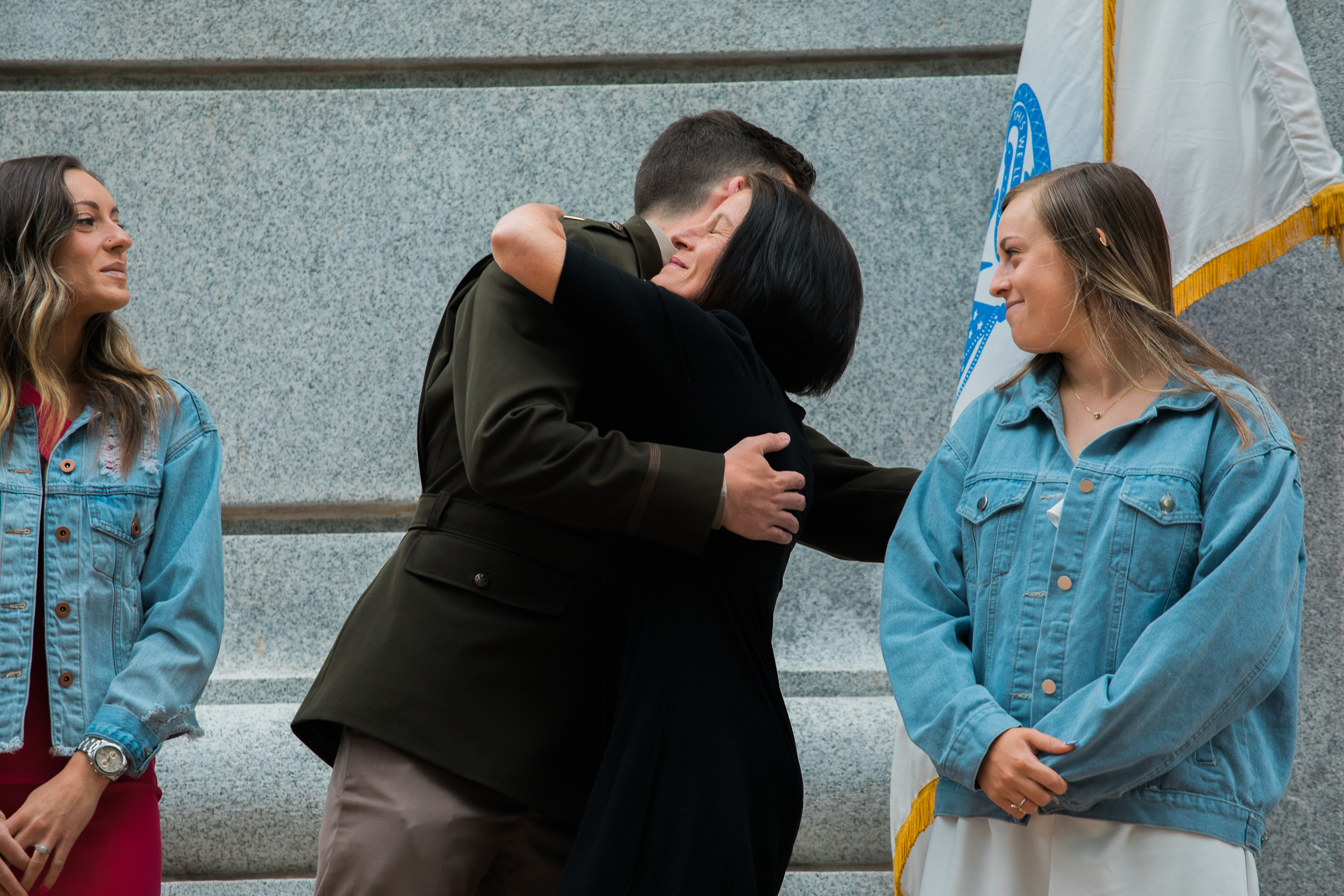 Student hugging family during commissioning ceremony